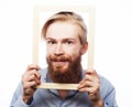 Young man holding picture frame Royalty Free Stock Photo