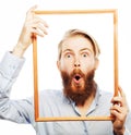 Young man holding picture frame Royalty Free Stock Photo