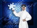 Young man holding a piece of puzzle Royalty Free Stock Photo