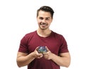 Young man holding piggy bank on white background. Money savings concept Royalty Free Stock Photo