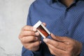 Young man holding pill contianer with copy space Royalty Free Stock Photo