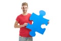 Young man holding a puzzle piece Royalty Free Stock Photo