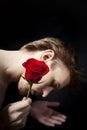 Young man holding a red rose Royalty Free Stock Photo