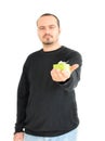 Young man holding small gift(focus on gift) Royalty Free Stock Photo