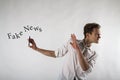 Young man holding smartphone in his hands. Antipathy, dislike and refuse concept. Fake news Royalty Free Stock Photo