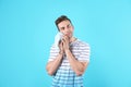 Young man holding toilet paper roll Royalty Free Stock Photo