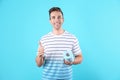 Young man holding toilet paper roll Royalty Free Stock Photo