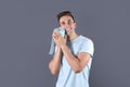 Young man holding toilet paper roll Royalty Free Stock Photo