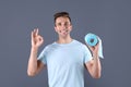 Young man holding toilet paper roll Royalty Free Stock Photo