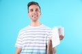 Young man holding toilet paper roll Royalty Free Stock Photo