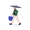 Young man holding umbrella, carrying bag. Guy with parasol walking in rainy weather. Person step over puddle. Boy under