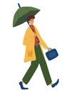 Young man holding an umbrella, walking under the rain. Cheerful businessman in a raincoat returns from work. Autumn fall weather Royalty Free Stock Photo