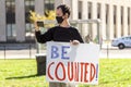 A young man holds a banner that says be Counted referring to vote counting Royalty Free Stock Photo