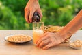 Young man holds bottle of beer and fills glass Royalty Free Stock Photo