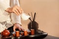 A young man holds a Chinese tea ceremony Royalty Free Stock Photo