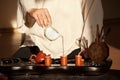 A young man holds a Chinese tea ceremony Royalty Free Stock Photo