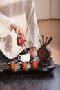 Young man holds a Chinese tea ceremony Royalty Free Stock Photo