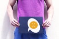 A young man holds a placard at the level of the genitals Royalty Free Stock Photo