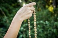 Young man holds a rosary in his hands and pray Royalty Free Stock Photo