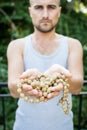 Young man holds a rosary in his hands and pray Royalty Free Stock Photo