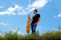 A young man holds the wing ribs.