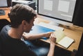 Young man at home using a computer Royalty Free Stock Photo