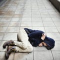 Young man homeless sleep on the street Royalty Free Stock Photo