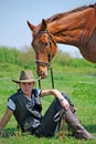 Young man and horse Royalty Free Stock Photo