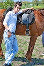 Young man and horse Royalty Free Stock Photo