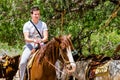 Young man horseback riding on the beach in Cabo san Lucas, Baja California Royalty Free Stock Photo