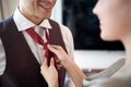 A young man at hotel room dressing up for a business meeting. Hotel  business  people Royalty Free Stock Photo