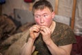 Young man is hungry, eating fresh fish with pleasure