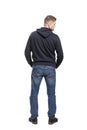 A young man in jeans. Back view. Full height. Isolated over white background.