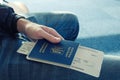 Young man in jeans holding in hand foreign passport of Ukraine Royalty Free Stock Photo