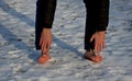 Young man in jeans running away barefoot in the snow. Detained by police lying on the ground with his hands behind his back, no sh