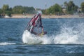 Young Man on Jet Ski-Water Sports in the summer having fun on the beach Royalty Free Stock Photo