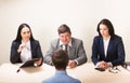 Young man during job interview and members of managemen Royalty Free Stock Photo