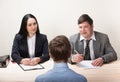 Young man during job interview and members of managemen Royalty Free Stock Photo