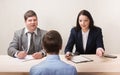 Young man during job interview and members of managemen Royalty Free Stock Photo