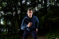 Young man jogging at night. Royalty Free Stock Photo