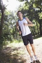 Young Man Jogging Through Woodland Royalty Free Stock Photo