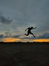 The young man jump with sunset times