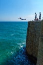 Young man jump from the wall, in Acre