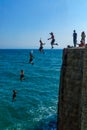 Young man jump from the wall, in Acre