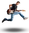 Young man jumping with electric guitar Royalty Free Stock Photo