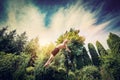 Young man jumping high in a garden. Royalty Free Stock Photo