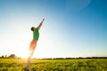 Young man jumping on meadow with dandelions Royalty Free Stock Photo