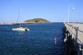 Young man jumping off from Coffs Harbour Jetty New South Walse Australia Royalty Free Stock Photo