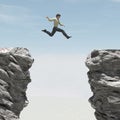 Young man jumping over the chasm Royalty Free Stock Photo