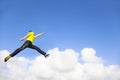 Young man jumping and pointing to sky Royalty Free Stock Photo